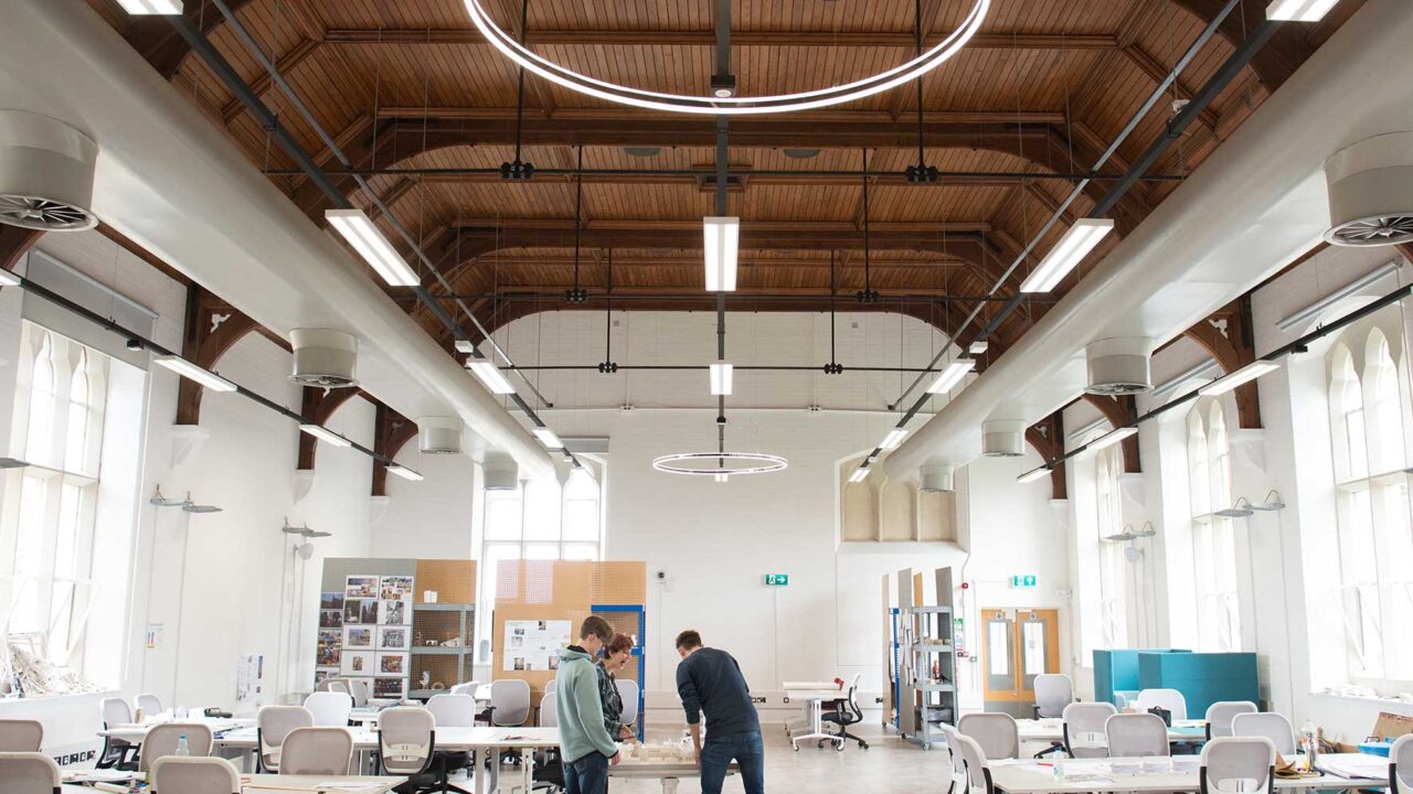 Architecture studio space with good lighting, high ceilings, desk spaces.