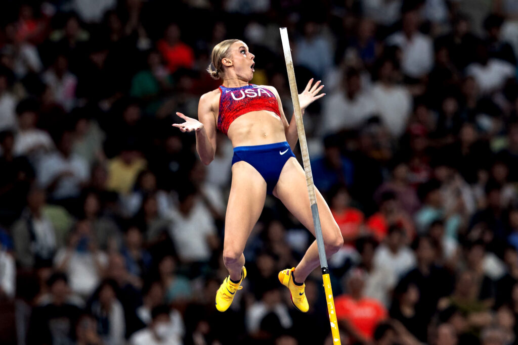 American pole vaulter Katie Moon pictured in the air with palms up with a shocked look on her face