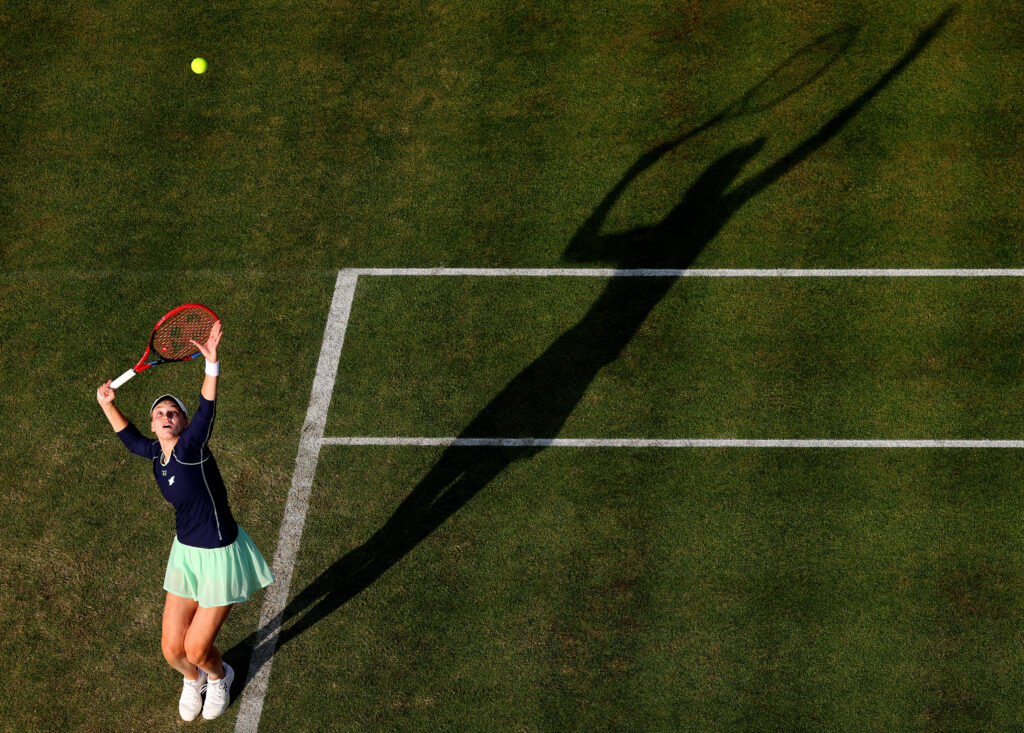 Pictured from above, Kazakhstan’s Elena Rybakina serving at the WTA Queen’s Club Championships on a grass coourt