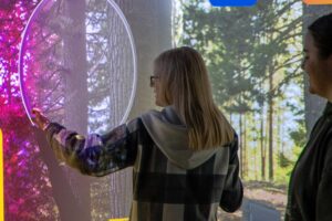 A student interacts with the digital screens showing a simulated crime scene in at the FutureSim facility.