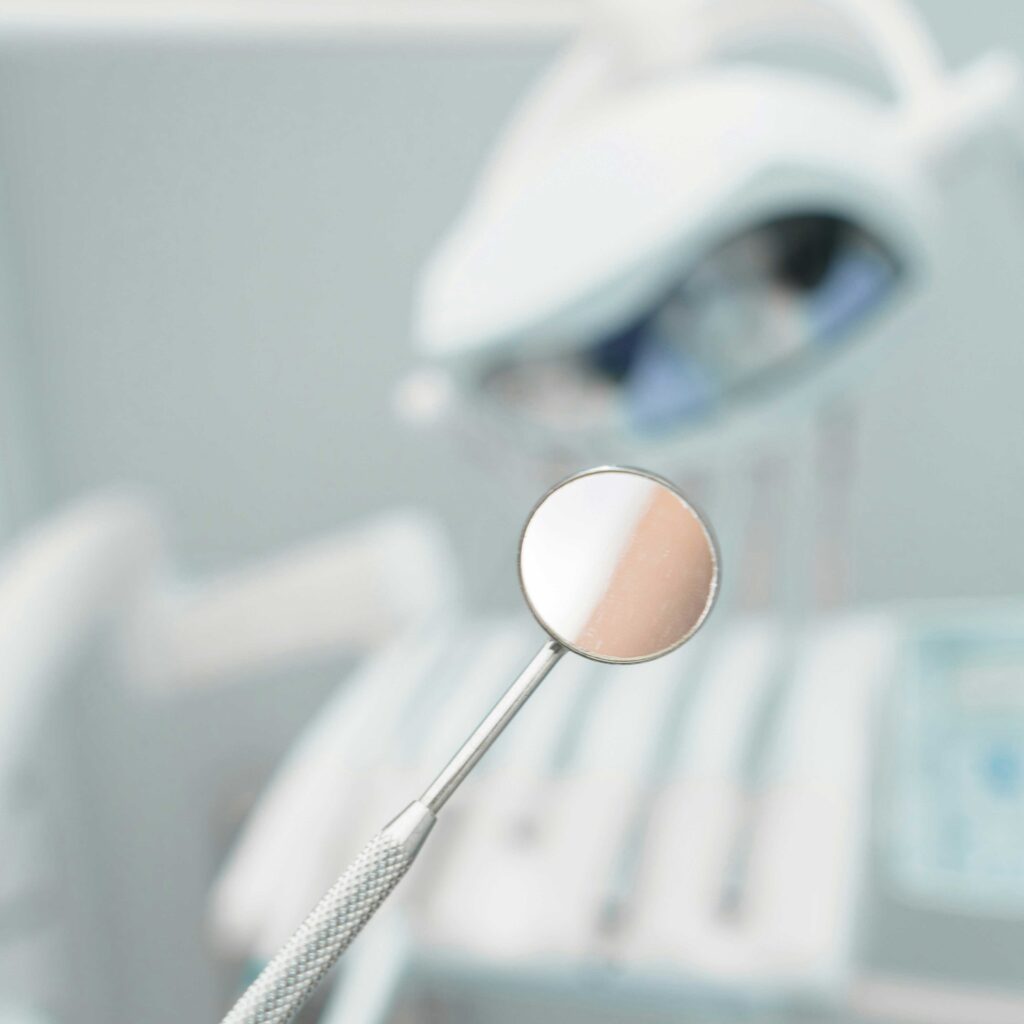 A close up of a mirror used by dentists.