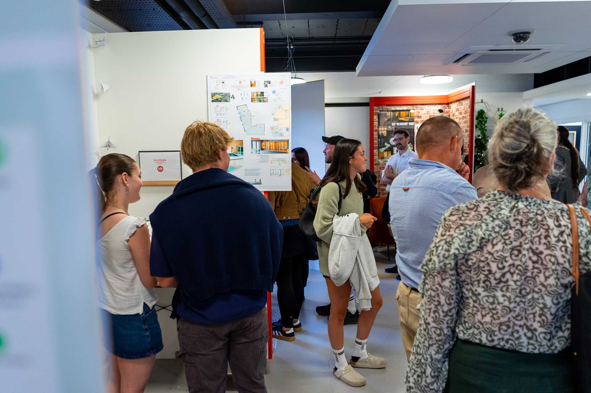 The annual Degree Show with guests looking at exhibitions of student work.