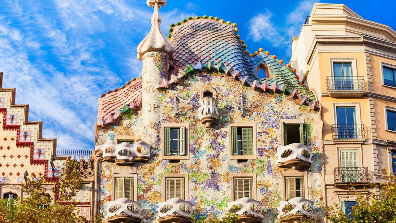 A view of the facades of buildings in Barcelona showing Gaudi architecture.