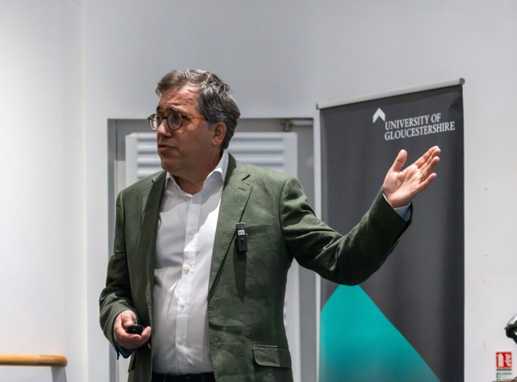 Professor Matt Reed , pictured from the waist up, delivering his inaugural lecture